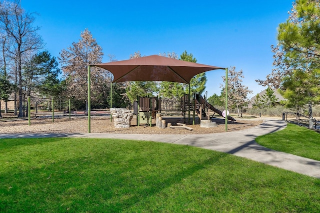 communal playground featuring a yard