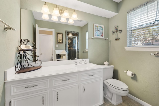 full bathroom with a shower with door, a textured wall, toilet, vanity, and baseboards