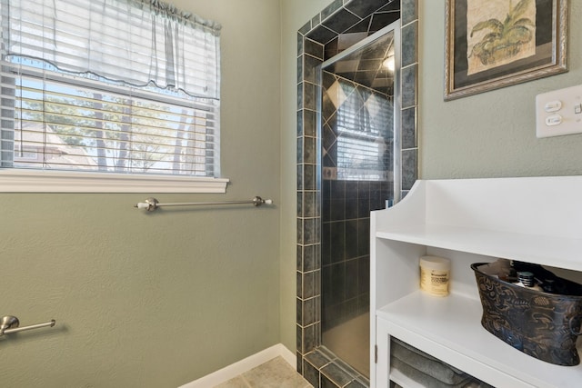 bathroom with a tile shower