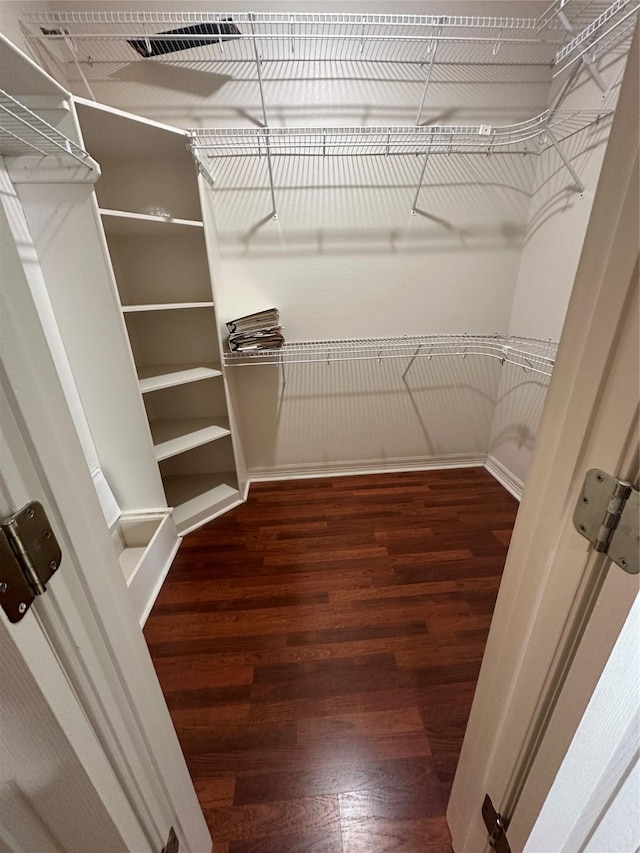 spacious closet with visible vents and wood finished floors