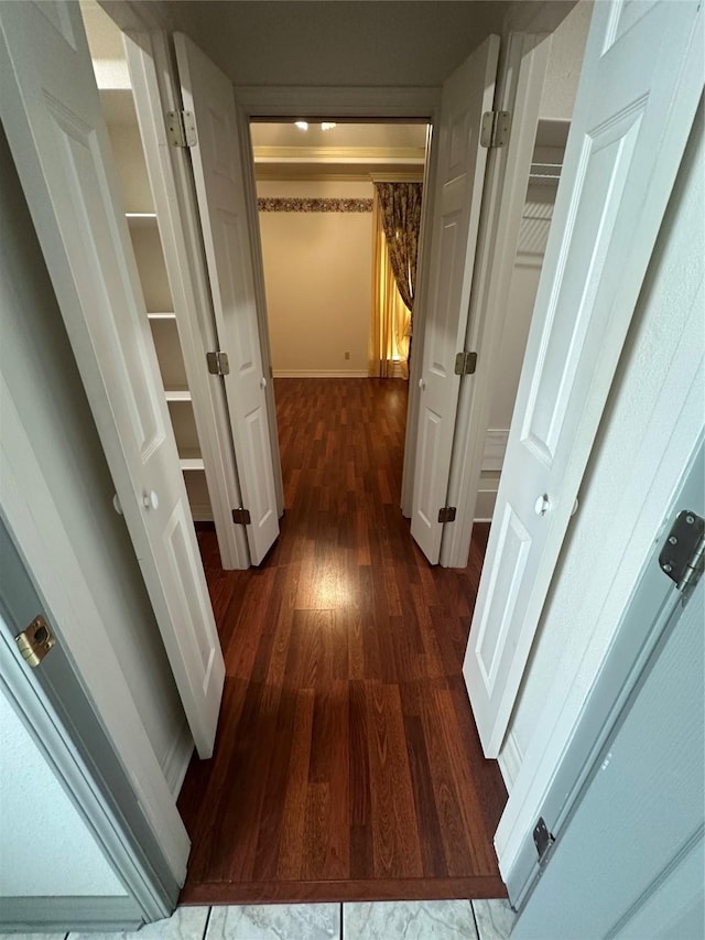 hallway with wood finished floors