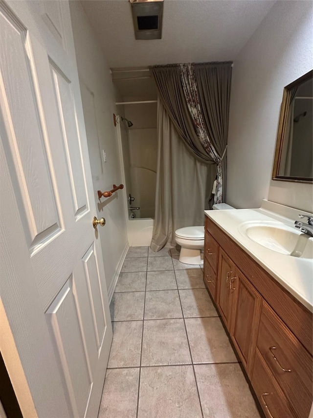 full bath featuring toilet, tile patterned flooring, shower / bath combo with shower curtain, and vanity