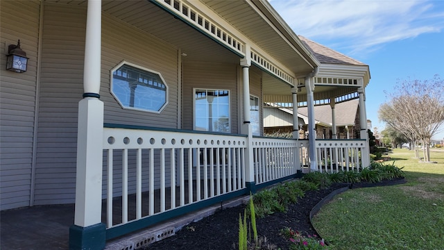 view of home's exterior with covered porch and a shingled roof