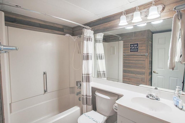 bathroom featuring shower / bathtub combination with curtain, toilet, and vanity