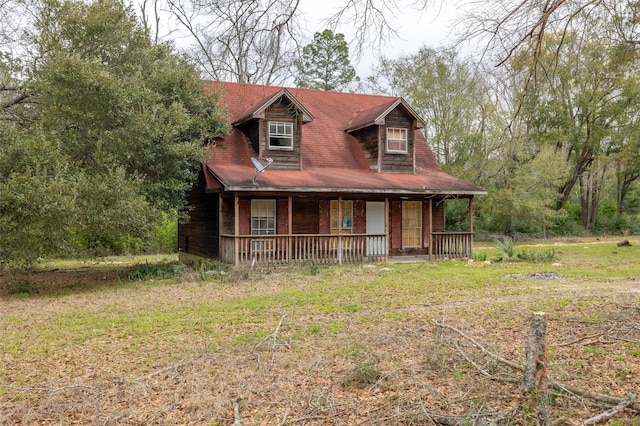 rustic home featuring covered porch