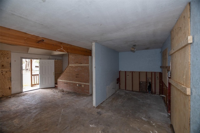 interior space featuring unfinished concrete flooring