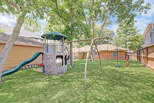 view of play area featuring a yard and fence