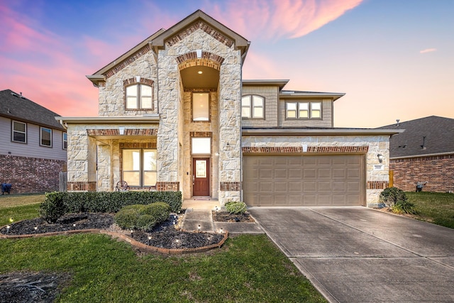 view of front of house featuring stone siding and concrete driveway