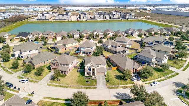 birds eye view of property with a residential view and a water view