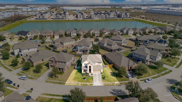 birds eye view of property featuring a residential view and a water view