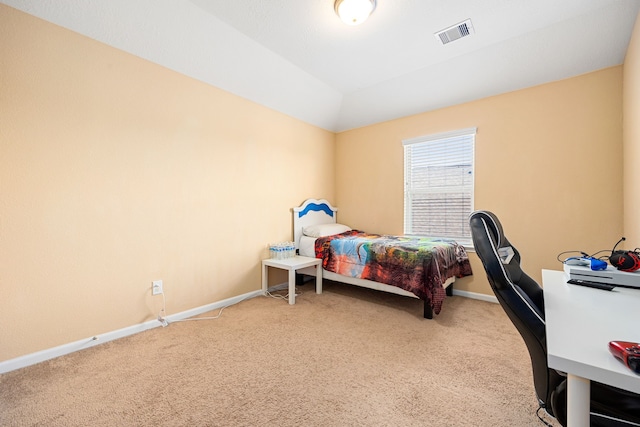 carpeted bedroom featuring vaulted ceiling, visible vents, and baseboards