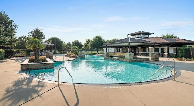 community pool featuring a patio area and a gazebo