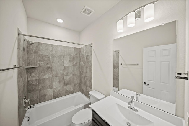 full bath with visible vents, shower / tub combination, vanity, and toilet