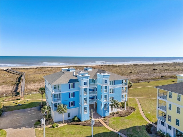 bird's eye view with a beach view and a water view