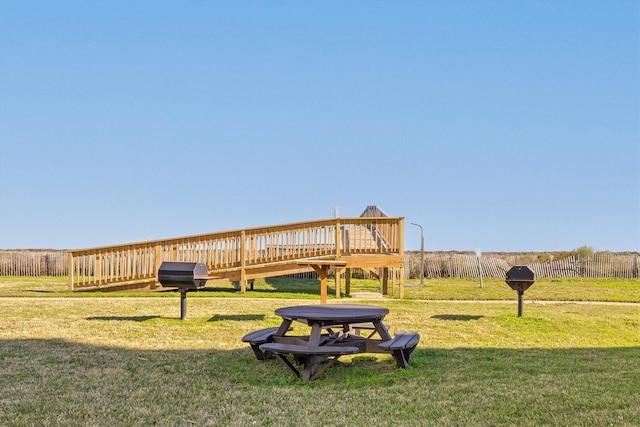 exterior space featuring a yard and a wooden deck