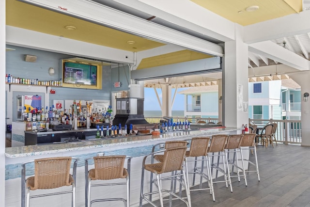 interior space featuring wood finished floors and beamed ceiling