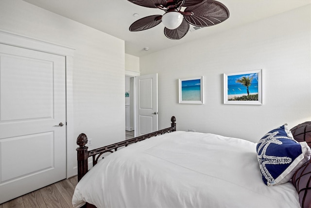 bedroom featuring ceiling fan and wood finished floors