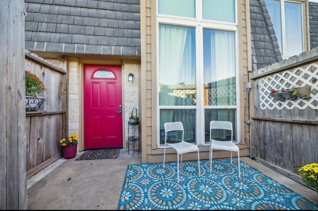 property entrance with mansard roof