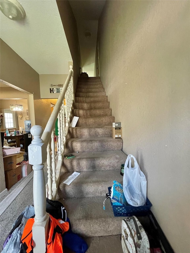 stairway with a textured wall