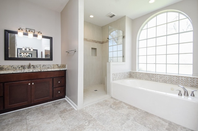 full bath with a garden tub, recessed lighting, vanity, visible vents, and tiled shower