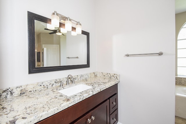 full bathroom with a bathtub and vanity