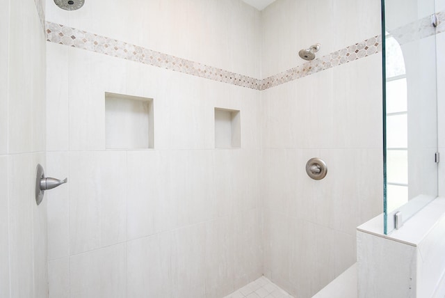 full bath with tiled shower