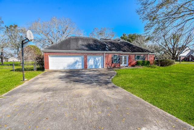 view of front of home with concrete driveway, french doors, a front yard, and brick siding