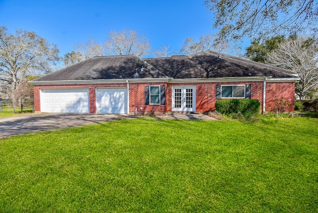 ranch-style house with a garage, driveway, a front lawn, and brick siding