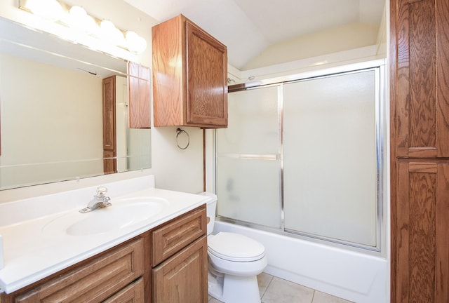 full bathroom with bath / shower combo with glass door, toilet, tile patterned flooring, vaulted ceiling, and vanity