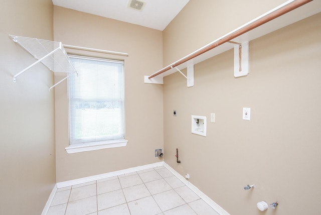 laundry area with laundry area, visible vents, hookup for a gas dryer, hookup for a washing machine, and electric dryer hookup