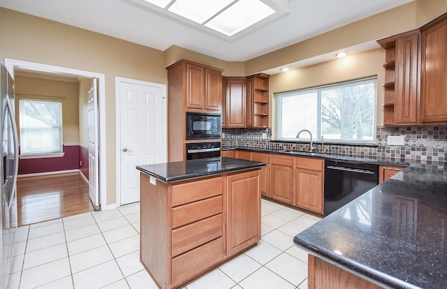 kitchen with black appliances, open shelves, a sink, and light tile patterned flooring