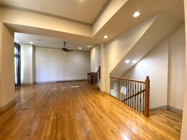 empty room featuring recessed lighting, wood-type flooring, a ceiling fan, ornamental molding, and baseboards