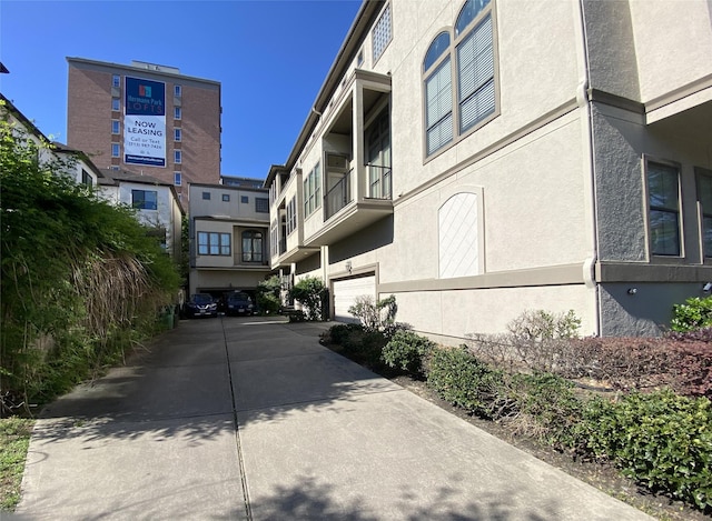 view of road with concrete driveway