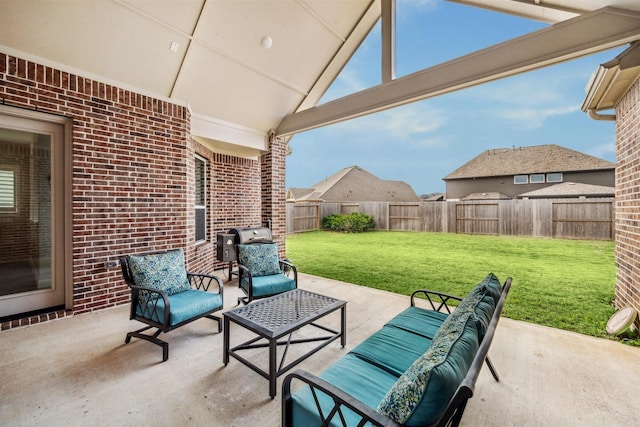 view of patio featuring a fenced backyard, outdoor lounge area, and grilling area