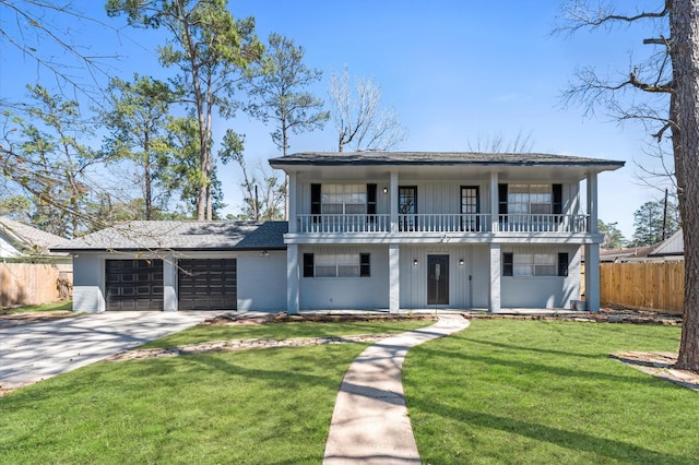 view of front of home featuring concrete driveway, an attached garage, fence, a balcony, and a front lawn