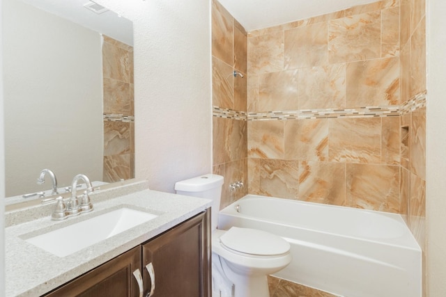 bathroom featuring toilet, bathtub / shower combination, and vanity