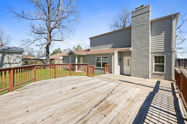 wooden terrace featuring fence