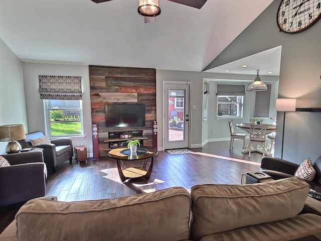 living room featuring wood finished floors, baseboards, recessed lighting, ceiling fan, and vaulted ceiling