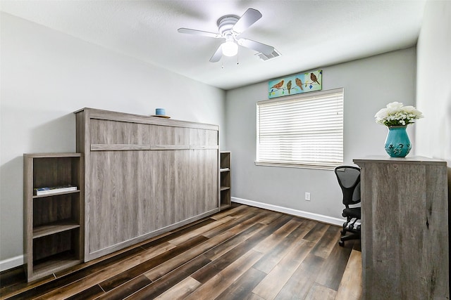 office area featuring a ceiling fan, dark wood-type flooring, baseboards, and visible vents