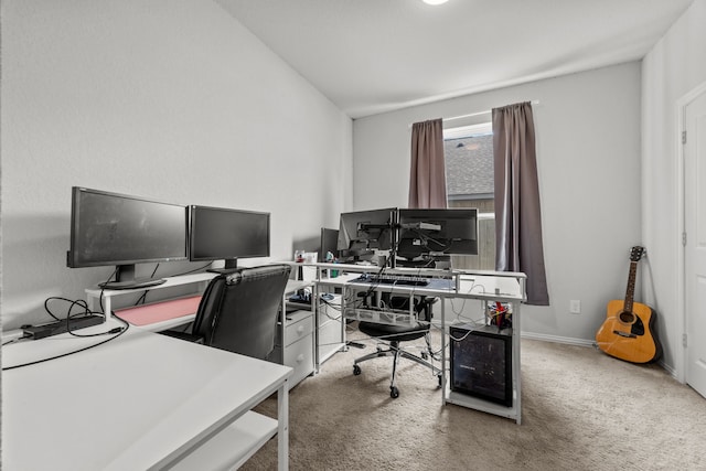 carpeted office featuring baseboards