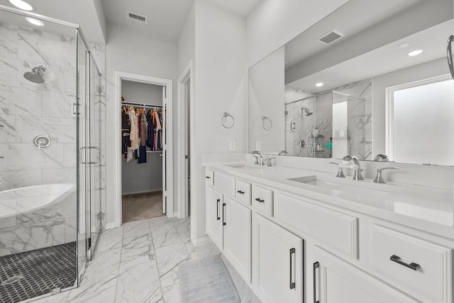 bathroom with marble finish floor, a sink, and visible vents