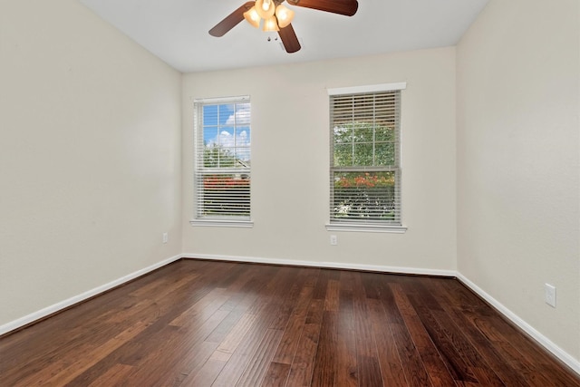 spare room with a ceiling fan, baseboards, and wood finished floors