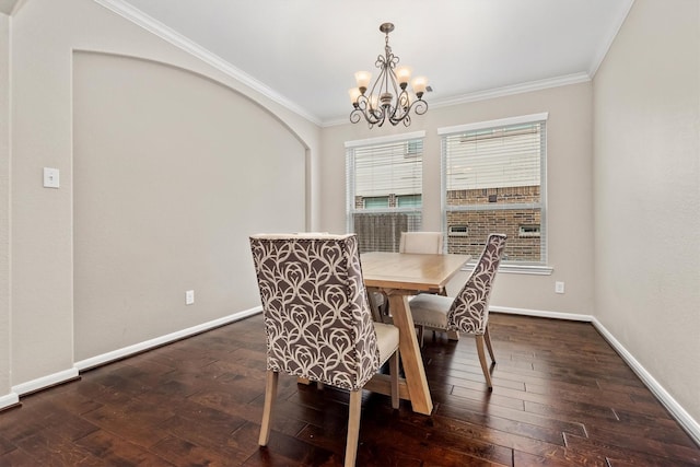 dining area with dark wood-style floors, baseboards, and crown molding