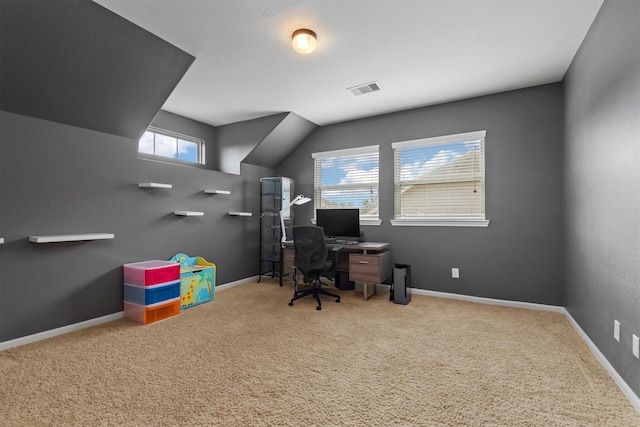 carpeted office space with baseboards and visible vents