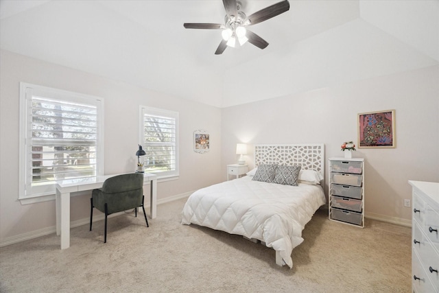 bedroom featuring baseboards, light carpet, and vaulted ceiling