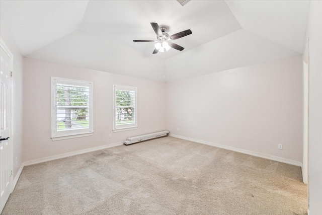 spare room with ceiling fan, light colored carpet, and lofted ceiling