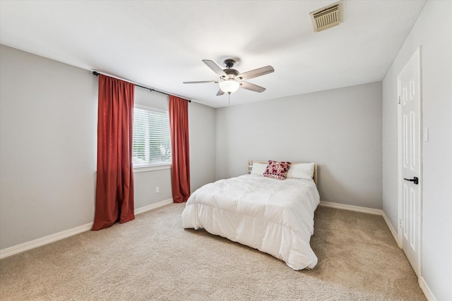 bedroom featuring baseboards, visible vents, ceiling fan, and carpet