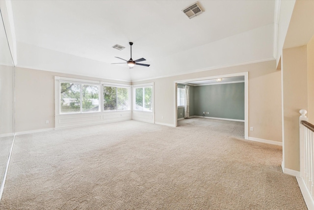 unfurnished room featuring visible vents, ceiling fan, and light carpet