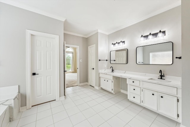 full bathroom featuring crown molding, a sink, double vanity, baseboards, and tile patterned floors