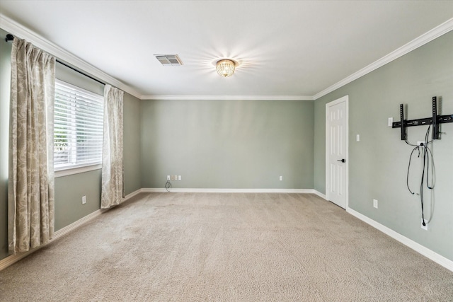 unfurnished room with baseboards, visible vents, ornamental molding, and carpet floors